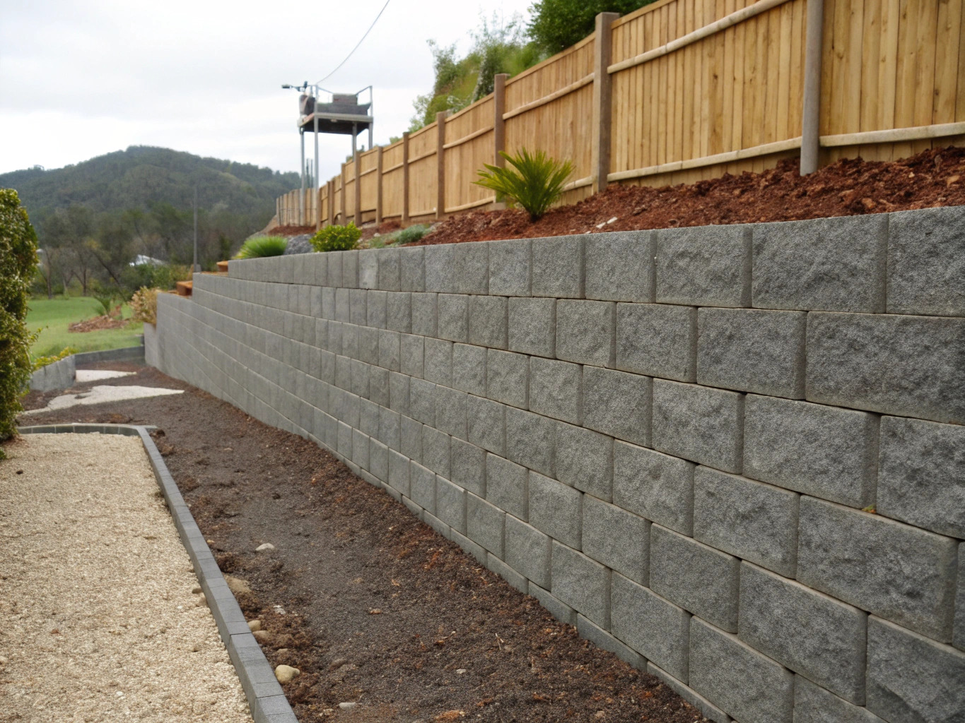 Retaining wall installers building a segmental retaining wall in Toowoomba